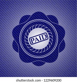 paid icon inside denim background
