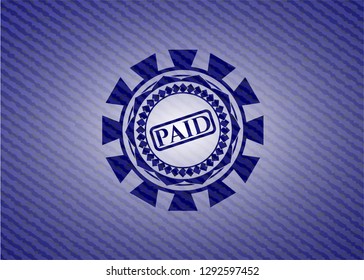 paid icon inside denim background
