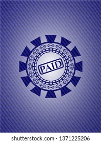 paid icon inside denim background