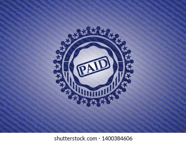paid icon inside denim background