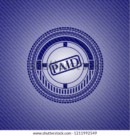 paid icon inside denim background