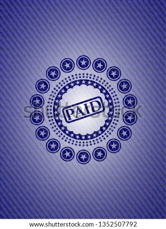 paid icon inside denim background