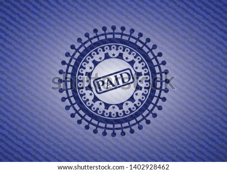 paid icon inside denim background
