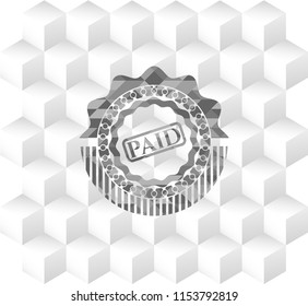 paid icon inside grey badge with geometric cube white background