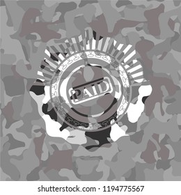 paid icon inside grey camouflage emblem