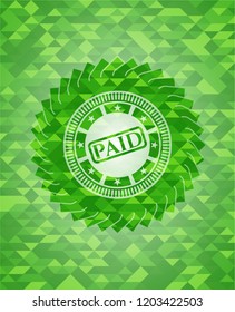 paid icon inside realistic green emblem. Mosaic background