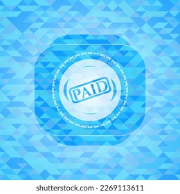 paid icon inside realistic light blue mosaic emblem. 
