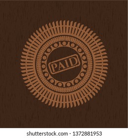 paid icon inside retro style wood emblem