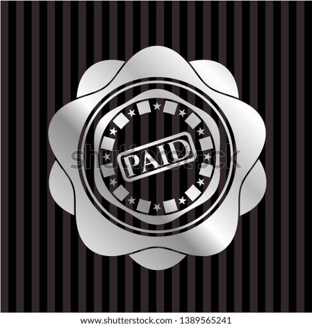 paid icon inside silver badge or emblem