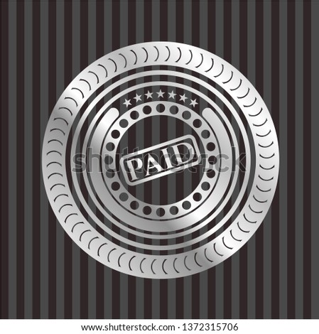 paid icon inside silver emblem
