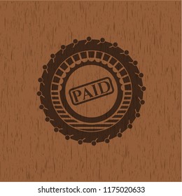 paid icon inside wood emblem