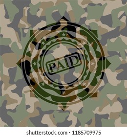 paid icon on camouflage pattern
