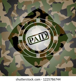 paid icon on camouflaged pattern