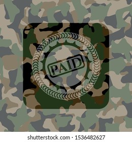 paid icon on camouflaged pattern