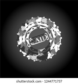 paid icon on grey camo texture