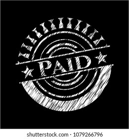 Paid on chalkboard