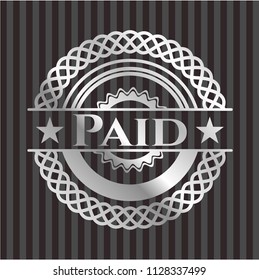 Paid silvery emblem