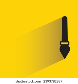 icono de pincel de pintura con sombra sobre fondo amarillo