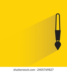 Farbpinselsymbol mit Schatten auf gelbem Hintergrund