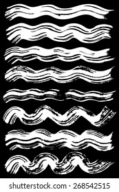 Paint brush strokes collection. Set of vector paint brush strokes. White design elements. EPS10 vector elements isolated on black.