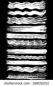 Paint brush strokes collection. Set of vector paint brush strokes. White design elements. EPS10 vector elements isolated on black.