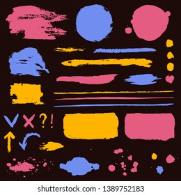 Paint brush strokes, grunge stains and symbols isolated on black background. Colored vector design elements for paintbrush texture, frame, background, banner or text box. Freehand drawing collection.