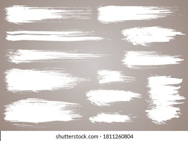 Paint brush. White ink grunge brush strokes. Vector paintbrush set. Grunge design elements. Painted ink stripes