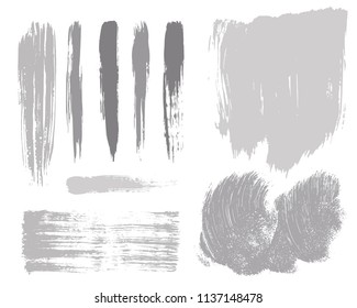 Paint lines grunge collection. Set of silver grungy hand drawn brush strokes isolated on white. Abstract ink texture, design elements, borders or frames. Brush strokes set backgrounds.