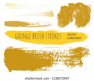 Paint lines grunge collection. Set of golden grungy hand drawn brush strokes isolated on white. Abstract ink texture, design elements, borders or frames. Brush strokes set backgrounds.