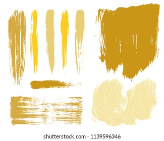 Paint lines grunge collection. Set of golden grungy hand drawn brush strokes isolated on white. Abstract ink texture, design elements, borders or frames. Brush strokes set backgrounds.