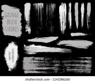 Paint lines grunge collection. Set of silver grungy hand drawn brush strokes isolated on black. Abstract ink texture, design elements, borders or frames. Brush strokes set backgrounds.