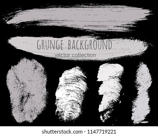 Paint lines grunge collection. Set of silver grungy hand drawn brush strokes isolated on black. Abstract ink texture, design elements, borders or frames. Brush strokes set backgrounds.