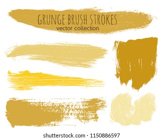 Paint lines grunge collection. Set of golden grungy hand drawn brush strokes isolated on white. Abstract ink texture, design elements, borders or frames. Brush strokes set backgrounds.