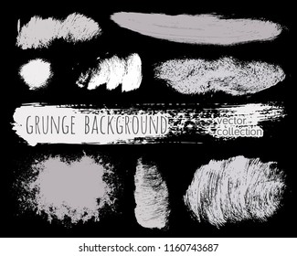 Paint lines grunge collection. Set of silver grungy hand drawn brush strokes isolated on black. Abstract ink texture, design elements, borders or frames. Brush strokes set backgrounds.