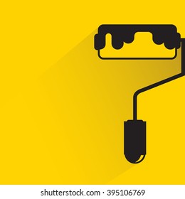 paint roller on yellow background, flat and shadow theme