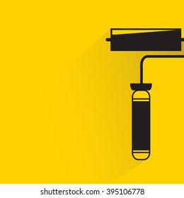 paint roller on yellow background, flat and shadow theme