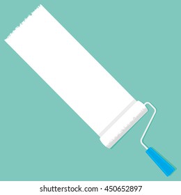 A paint roller with white paint on a green background