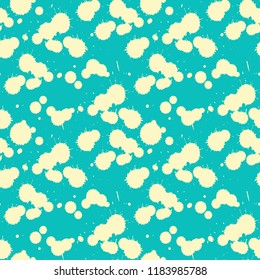 paint splatters seamless tile in ivory on blue