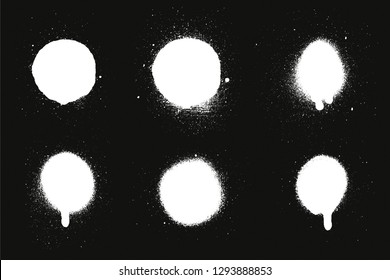Paint sprays from a can. Vector brush set. White splash on black background
