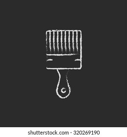 Paintbrush hand drawn in chalk on a blackboard vector white icon isolated on a black background.