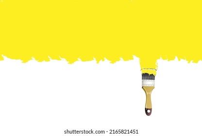 Paintbrush with yellow paint isolated over white background.