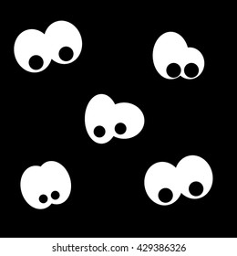 Painted cartoon eyes in the dark.