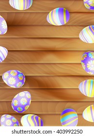 Painted Easter eggs on wooden background. top view. EPS 10 vector file included