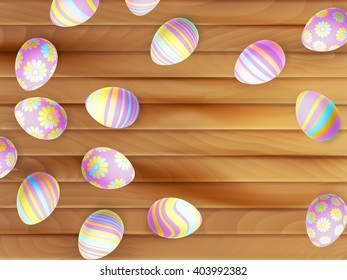 Painted Easter eggs on wooden background. top view. EPS 10 vector file included