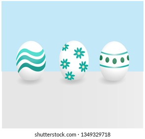 Painted eastereggs with pattern in the shades blue and green
