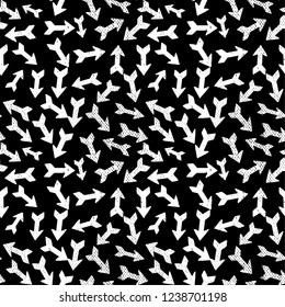Painted pattern with arrows on a black background.