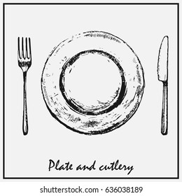 A painted plate with a fork and knife isolated on a light background.