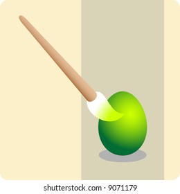 Painting a green Easter egg.