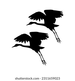 Pair of The Black Heron Bird (Egretta Ardesiaca), also known as the Black Egret Silhouette for Art Illustration, Logo, Pictogram, Website, or Graphic Design Element. Vector Illustration