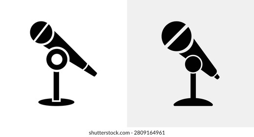 A pair of black microphone on a white background, featuring different stand bases for audio recording, broadcasting, and media production